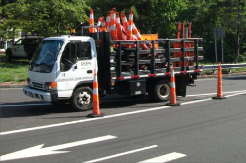 truck carrying construction cones